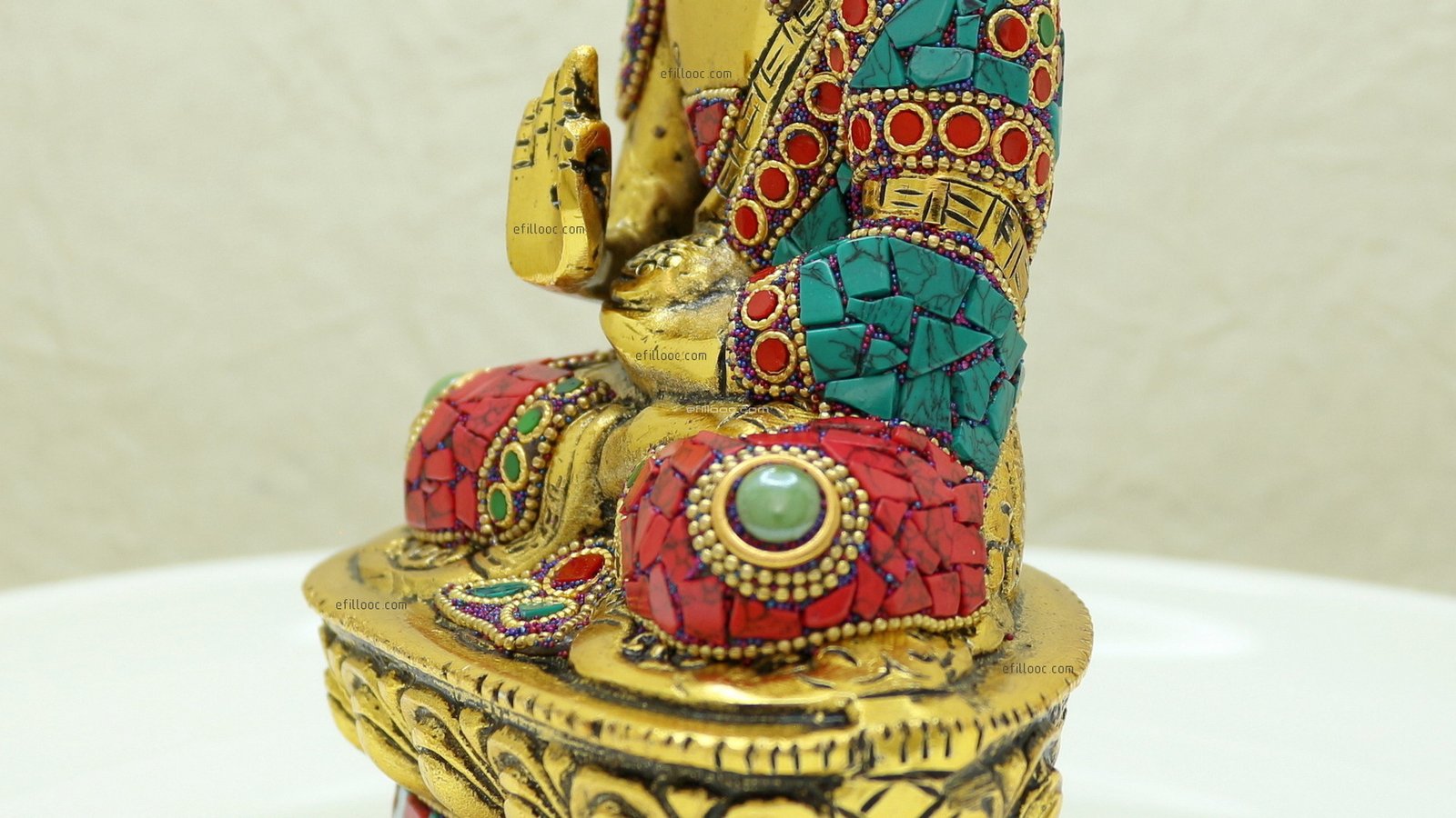 buddha idol on lotus sitting with blessing hand